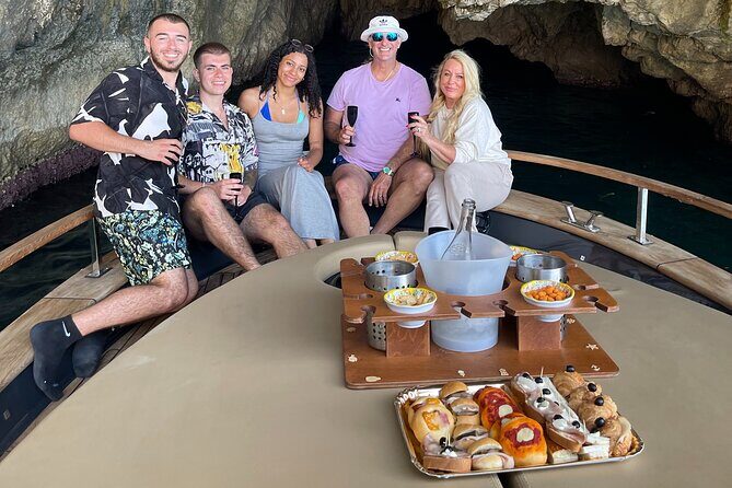 All-Inclusive Capri Boat Tour with City Visit from Positano - The onboard aperitif, swimming breaks, and snorkeling-style expectations