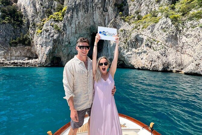Boat Tour in Capri Italy - The island route: Isola Azzurra coastline, grottos, and Faraglioni views