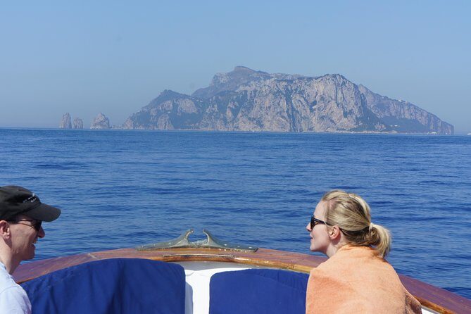 Capri & Blue Grotto Small Group Full-Day Boat Tour from Positano - The Blue Grotto plan: €18 admission, 5-minute cave time, and the line reality