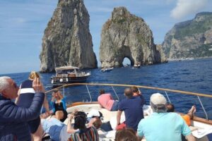 Capri Deluxe/First to Blue Grotto/from Sorrento Positano & Amalfi - Faraglioni and the Arch of Love: the most famous rocks, with an easy stop