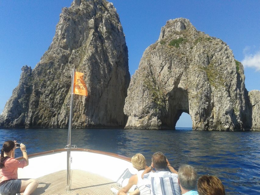 Capri: Island Boat Tour with Blue Grotto Stop - Faraglioni Rocks and Marina Piccola: Capri’s rock-and-water set pieces