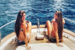 Capri private boat tour - Stop 2: I Faraglioni Pass-By and the Arch of Love Moment