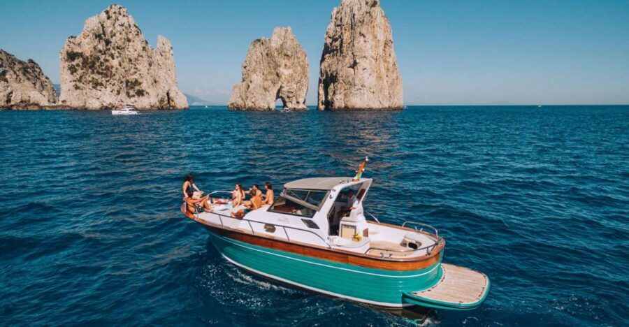 From Naples: Capri Boat Day Trip with Drinks - Faraglioni, Arco Naturale, and Casa Malaparte: the iconic rocks from the sea