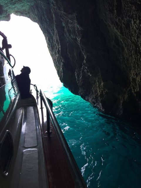 From Sorrento: Capri Guided Boat Tour - Capri from the water: Faraglioni, grotto sights, and captain discretion