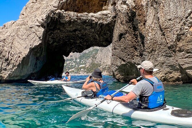 Kayak tour in Capri between caves and beaches. Photos included. - Arco della Stella and Faraglioni photos: the big visual payoff