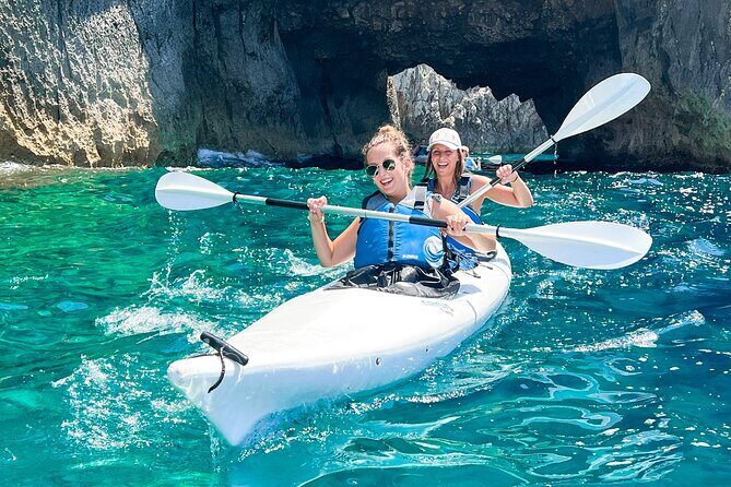 Kayak tour in Capri between caves and beaches. Photos included. - Price and value: $52.99 for caves, coaching, and not getting stuck on a big boat