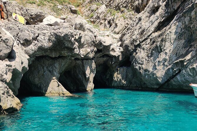 Private tour in a typical Capri boat - Faraglioni and Marina Piccola: Icons Plus a Real Beach Break
