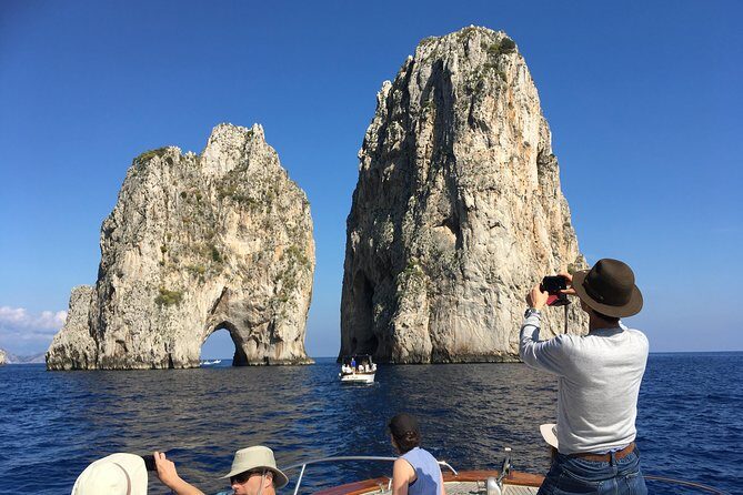 Sorrento: Capri Select Boat Trip with Swim, Drinks & Pick Up - I Faraglioni photos and the limestone icons